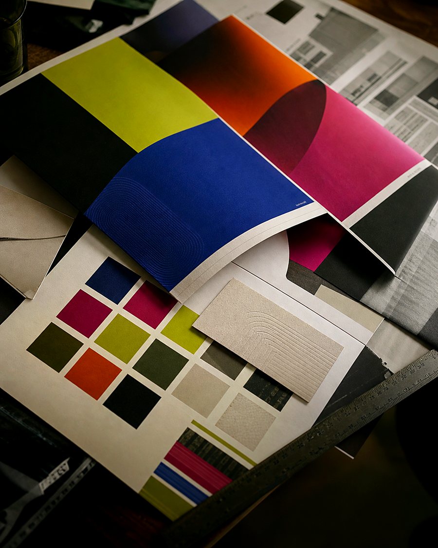 Brand identity flat lay with printed materials and colour swatches